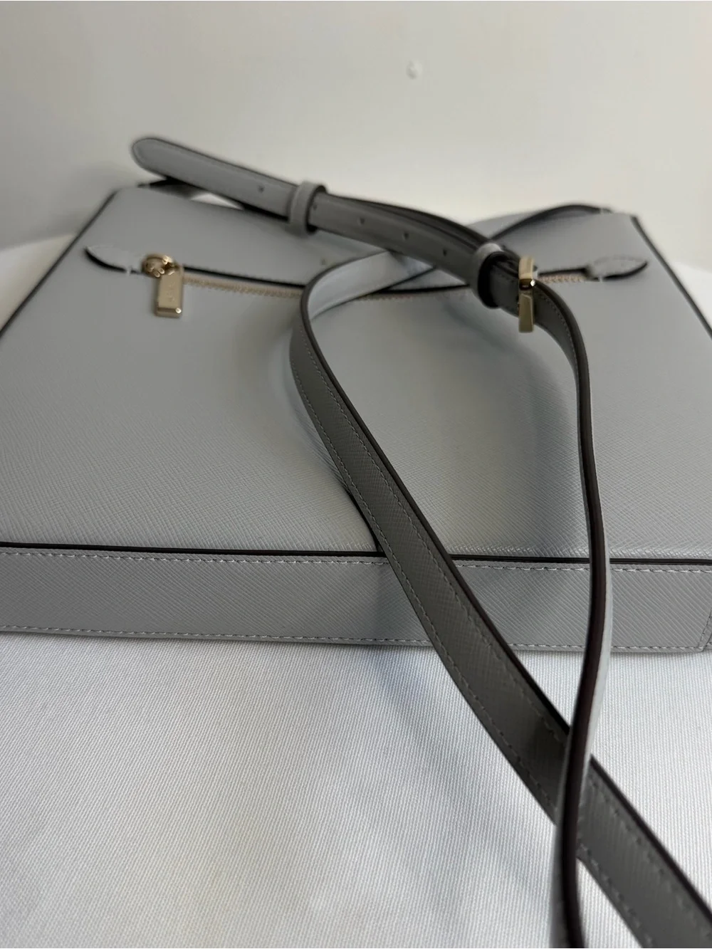kate spade light gray saffiano leather messenger bag with gold hardware